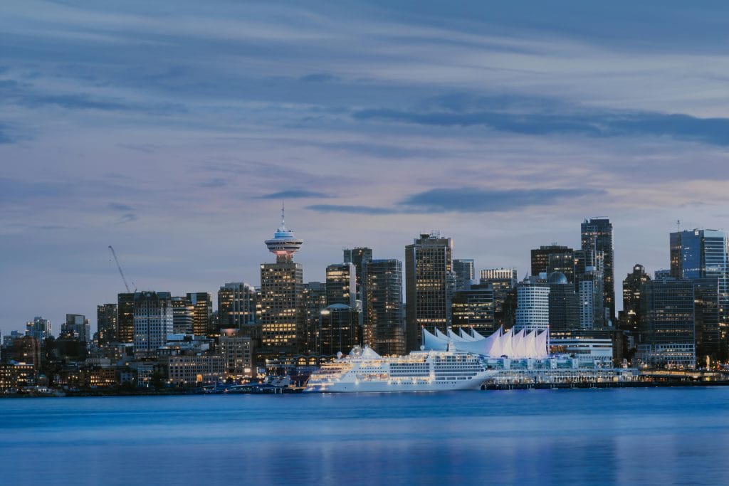 Vancouver city skyline at dusk overlooking the harbour, a popular backdrop for singles events in Vancouver